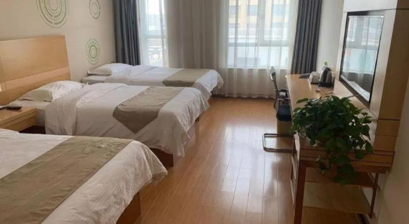 Bed in GreenTree Inn Shandong Heze Caoxian Zhuangzhai Town Oriental Times City Business Hotel