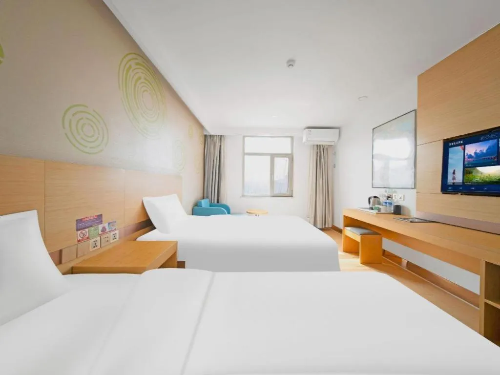 Bed in GreenTree Inn Binzhou Wudi County Yinzuo Plaza Express Hotel