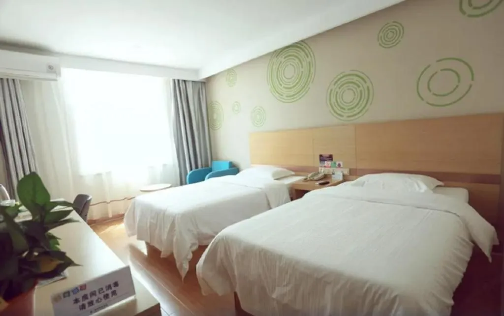 Bed in GreenTree Inn Binzhou Wudi County Yinzuo Plaza Express Hotel