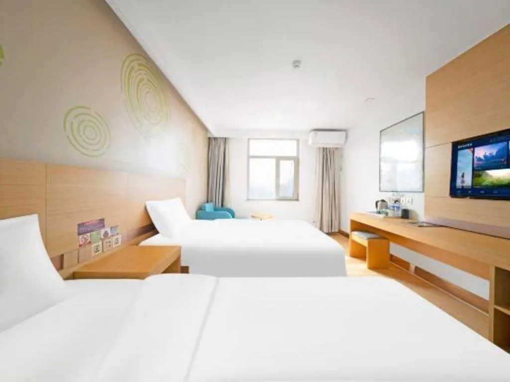 Bed in GreenTree Inn Binzhou Wudi County Yinzuo Plaza Express Hotel