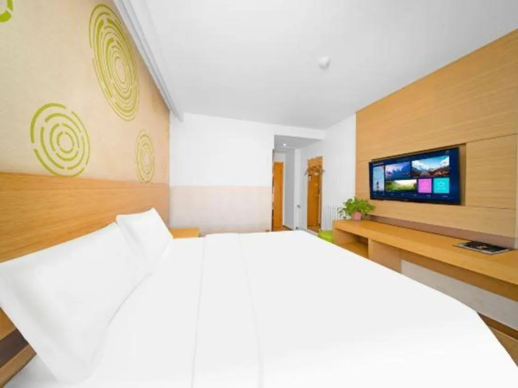 Bed in GreenTree Inn Binzhou Wudi County Yinzuo Plaza Express Hotel