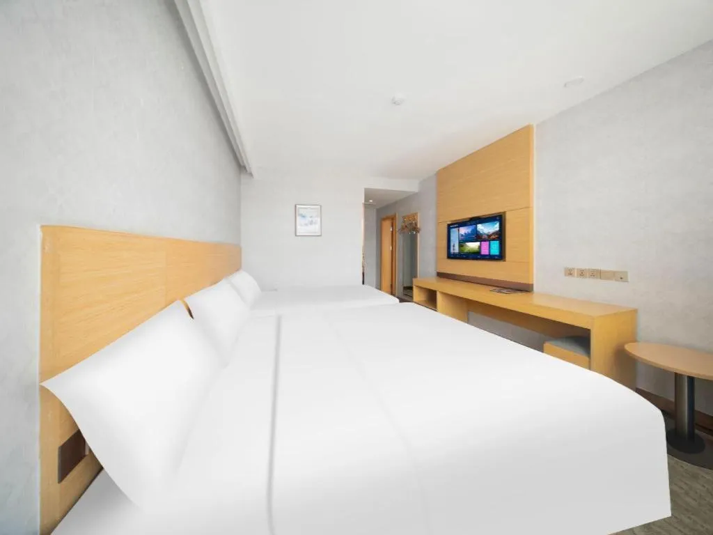 Bed in GreenTree Inn Binzhou Wudi County Yinzuo Plaza Express Hotel