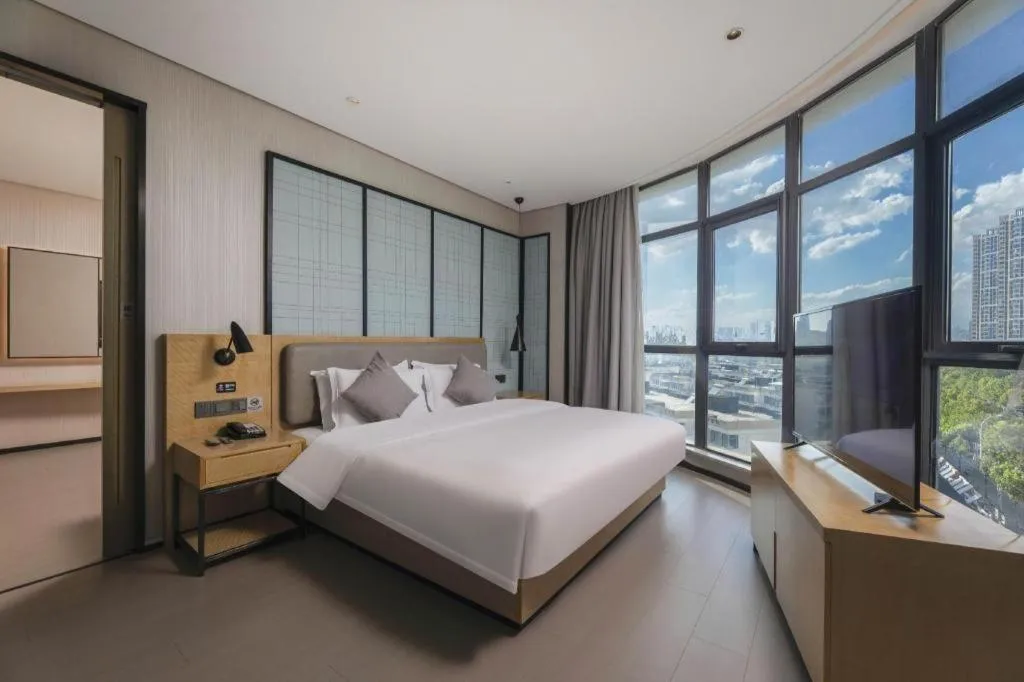 Bed in Echarm Hotel Wuxi Zhongnan Road Ancient Canal