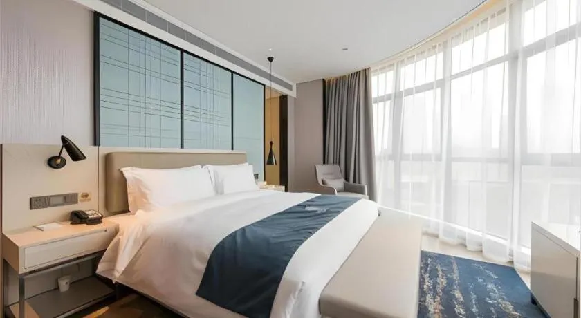 Bed in Echarm Hotel Wuxi Zhongnan Road Ancient Canal