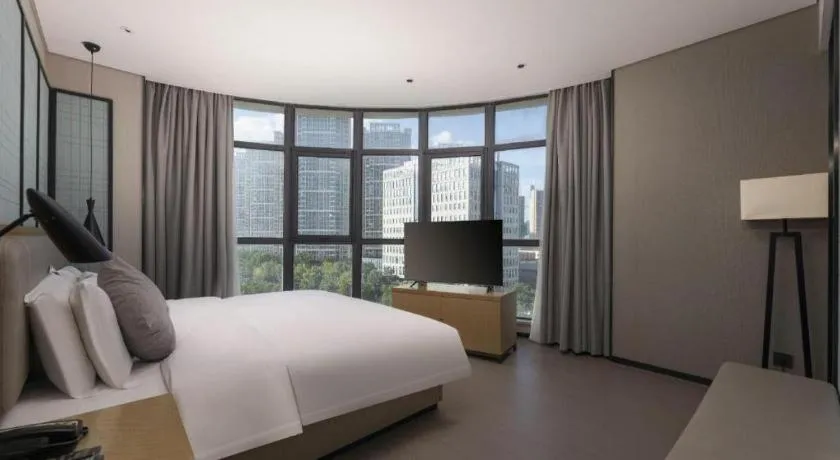 Bed in Echarm Hotel Wuxi Zhongnan Road Ancient Canal