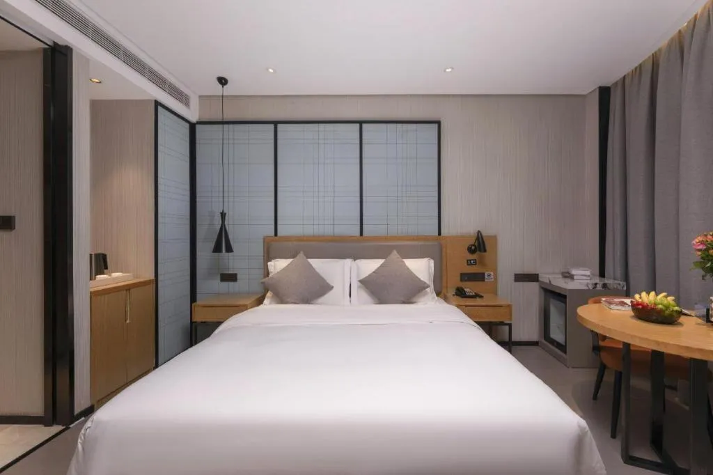 Bed in Echarm Hotel Wuxi Zhongnan Road Ancient Canal