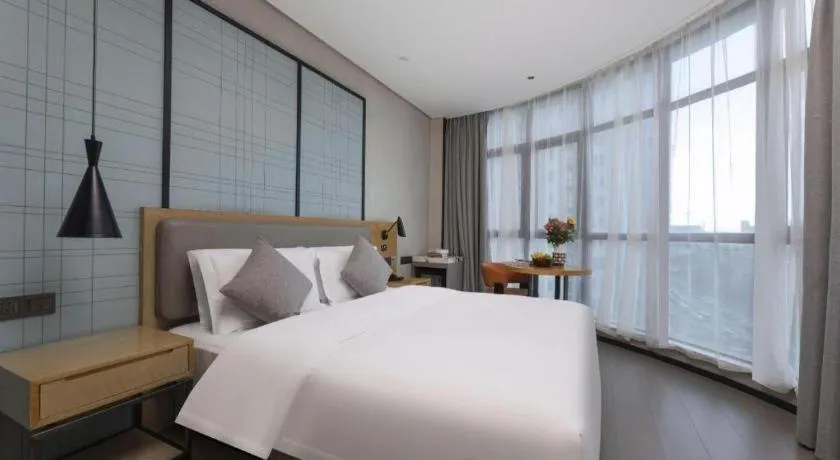 Bed in Echarm Hotel Wuxi Zhongnan Road Ancient Canal