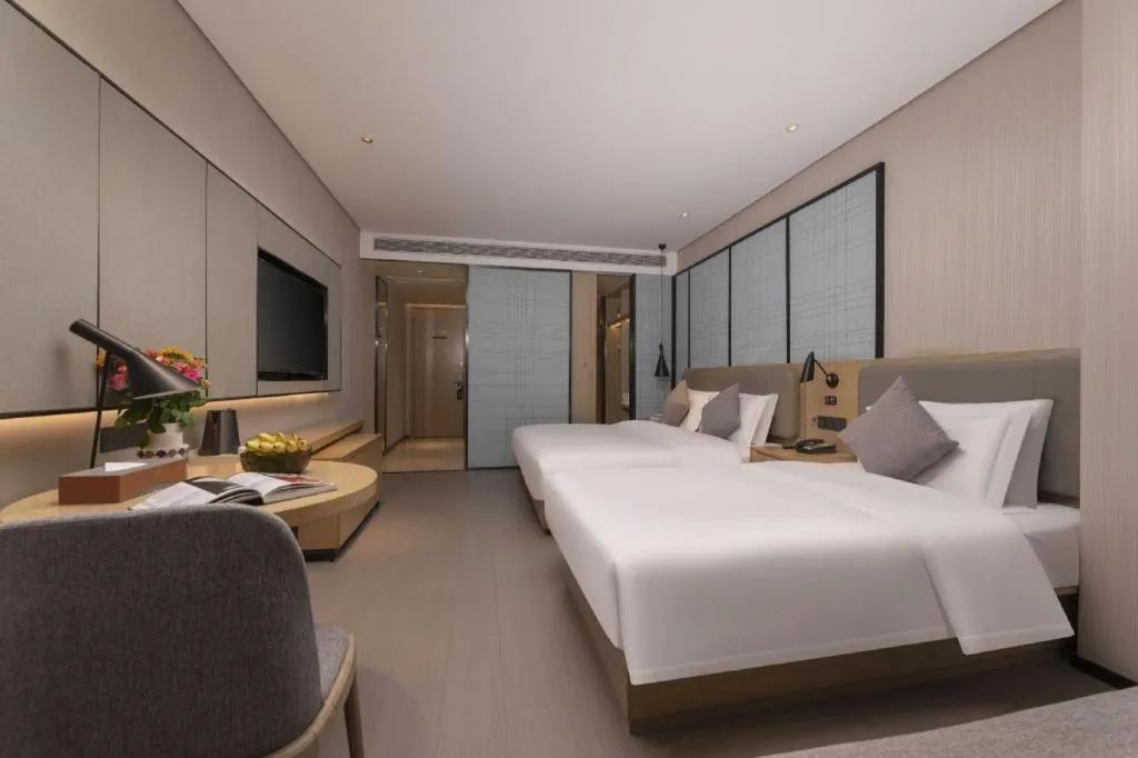 Bed in Echarm Hotel Wuxi Zhongnan Road Ancient Canal