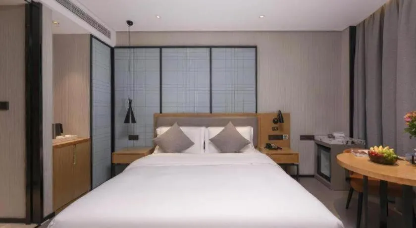 Bed in Echarm Hotel Wuxi Zhongnan Road Ancient Canal