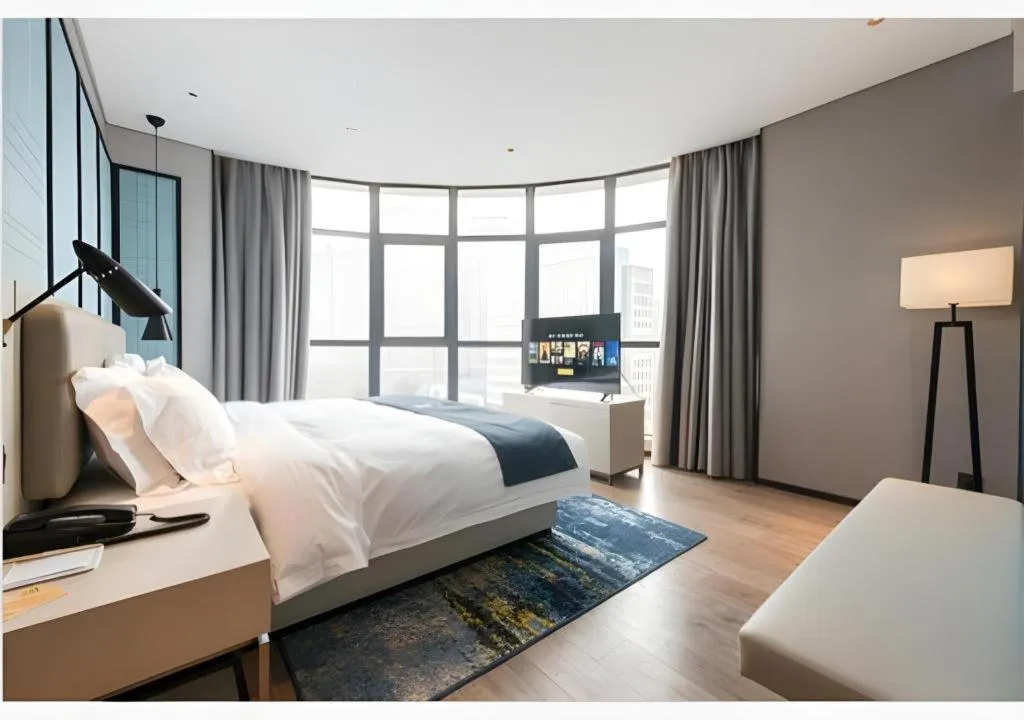 Bed in Echarm Hotel Wuxi Zhongnan Road Ancient Canal