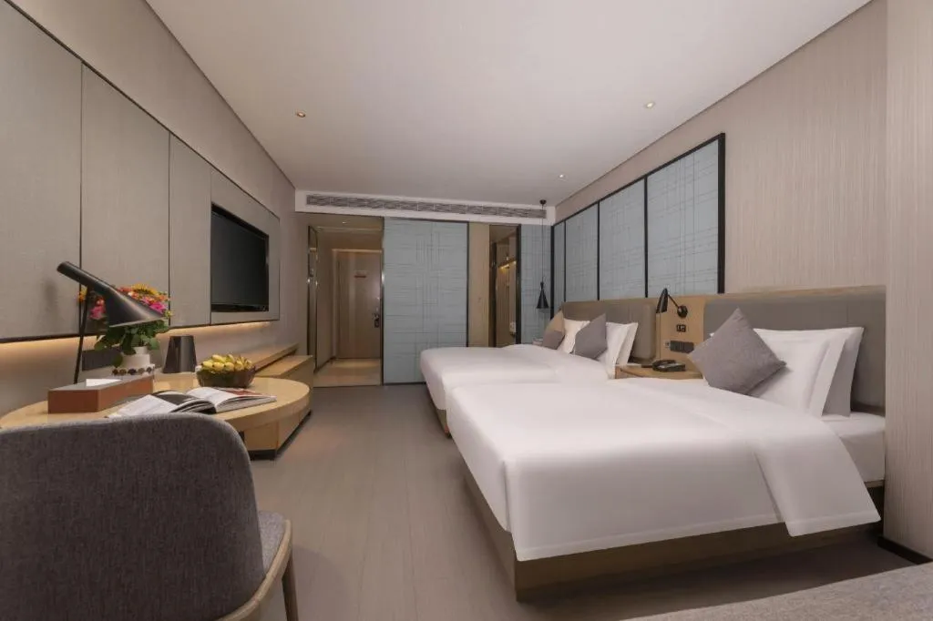 Bed in Echarm Hotel Wuxi Zhongnan Road Ancient Canal