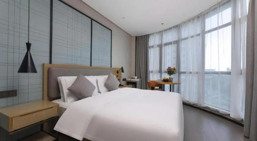Bed in Echarm Hotel Wuxi Zhongnan Road Ancient Canal
