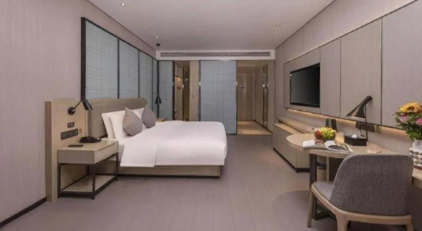 Bed in Echarm Hotel Wuxi Zhongnan Road Ancient Canal