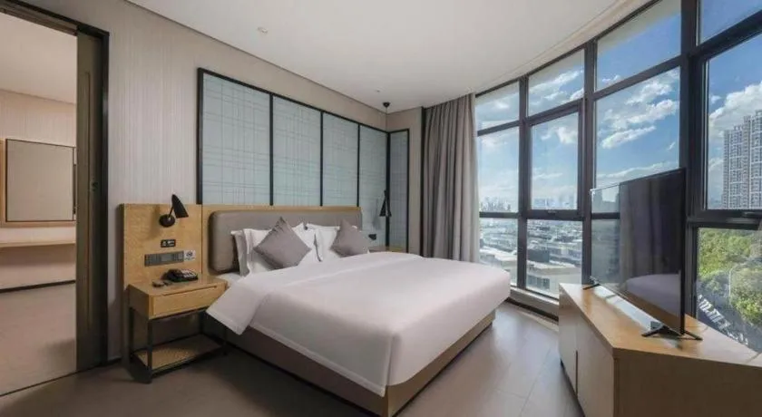 Bed in Echarm Hotel Wuxi Zhongnan Road Ancient Canal