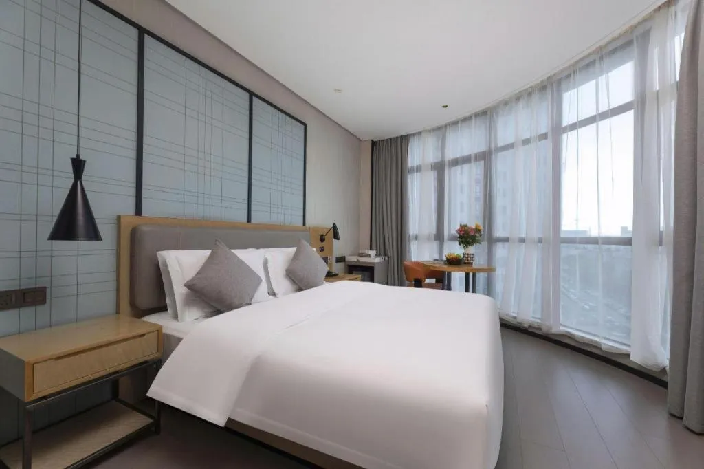 Bed in Echarm Hotel Wuxi Zhongnan Road Ancient Canal