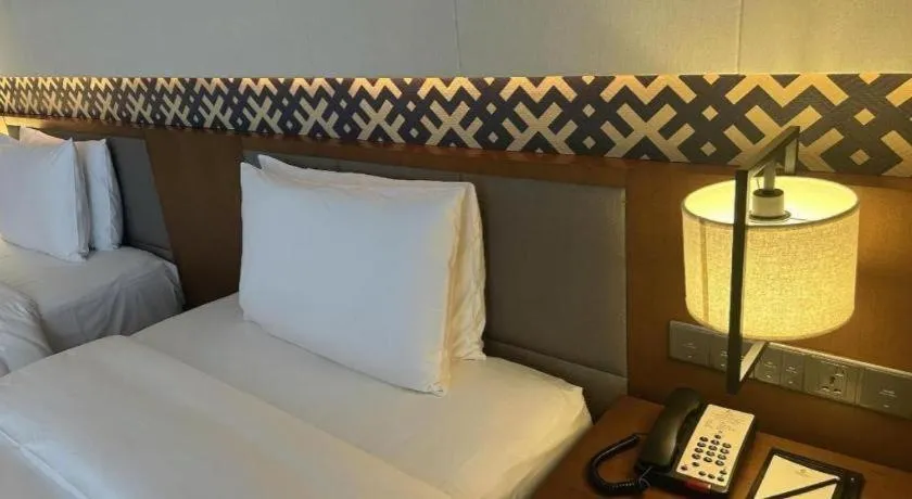 Bed in La Fountain Hotel & Resort Sanya