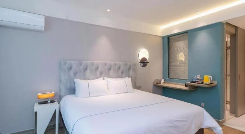 Bed in Magnotel Hotel Huizhou South Station Branch