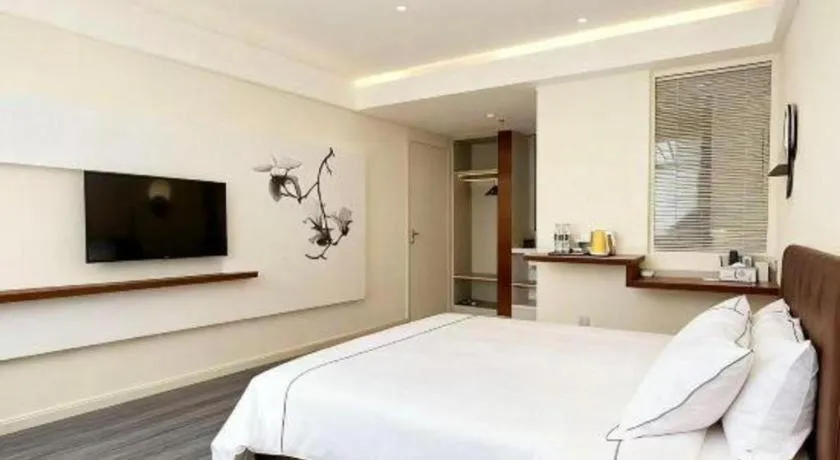 Bed in Magnotel Hotel Huizhou South Station Branch
