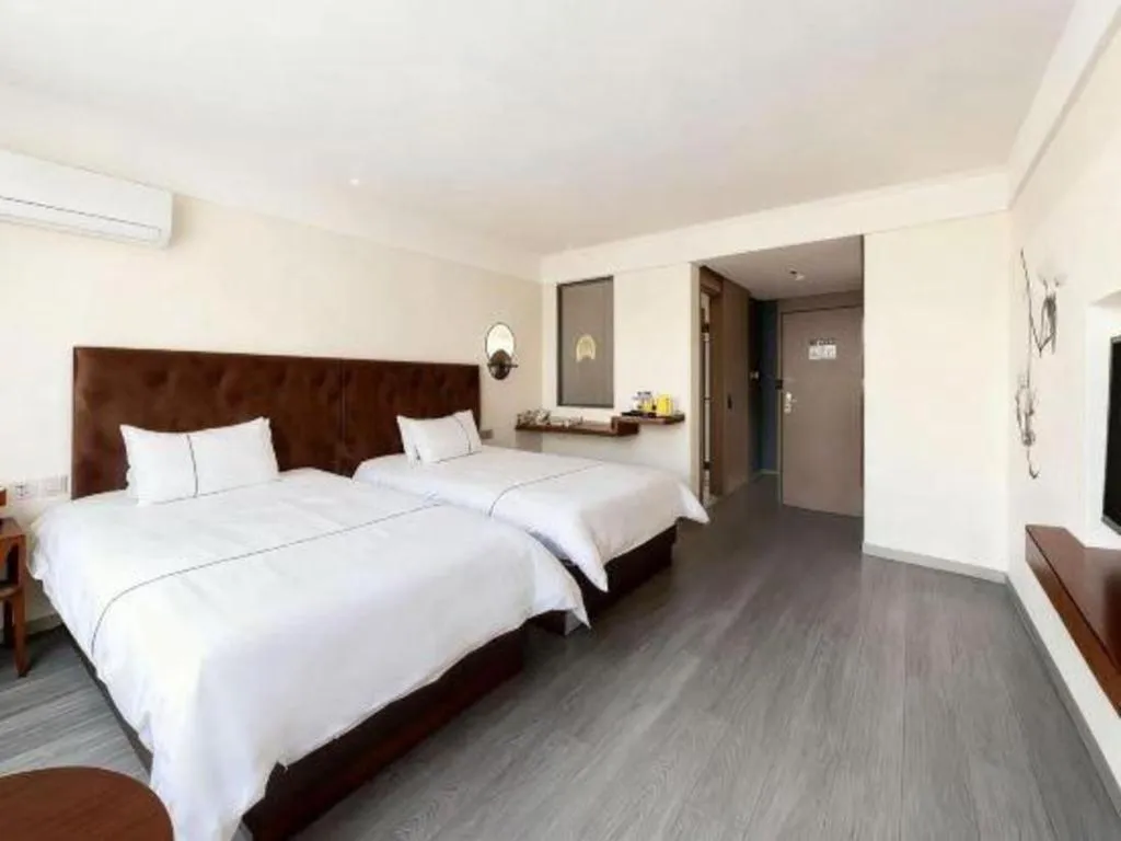 Bed in Magnotel Hotel Huizhou South Station Branch