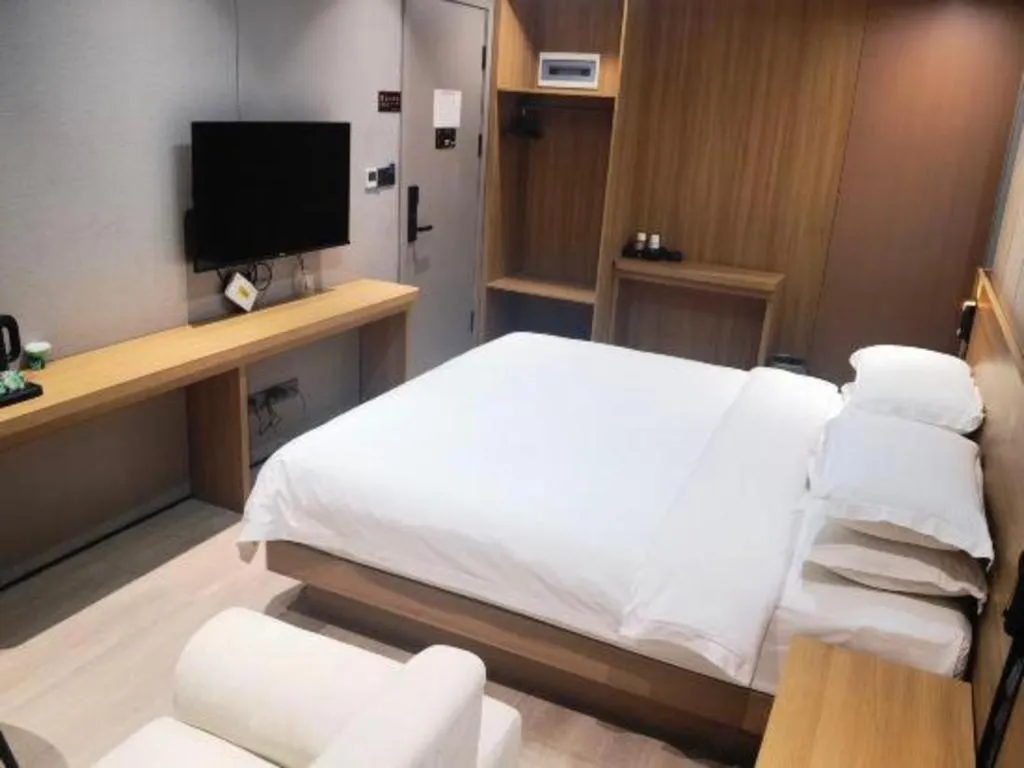 Bed in Magnotel Hotel Huizhou South Station Branch