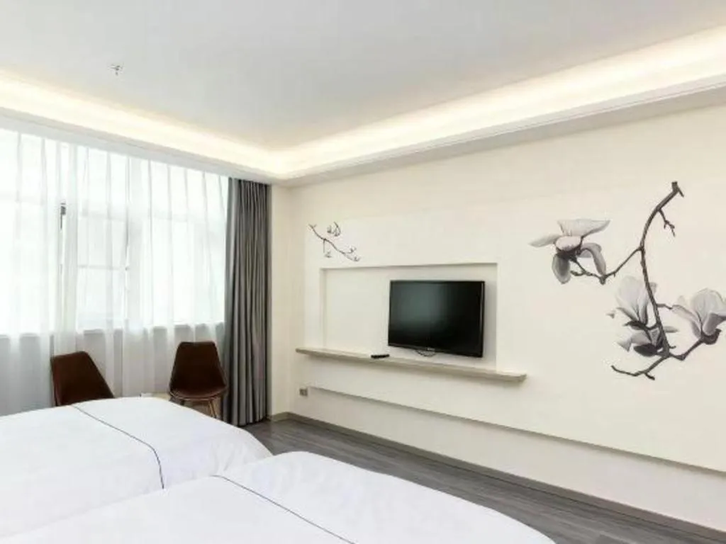 Bed in Magnotel Hotel Huizhou South Station Branch