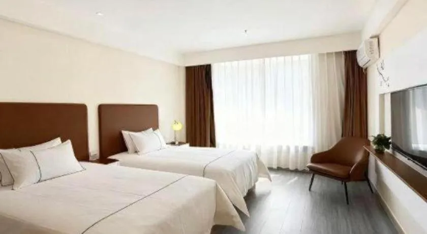 Bed in Magnotel Hotel Huizhou South Station Branch