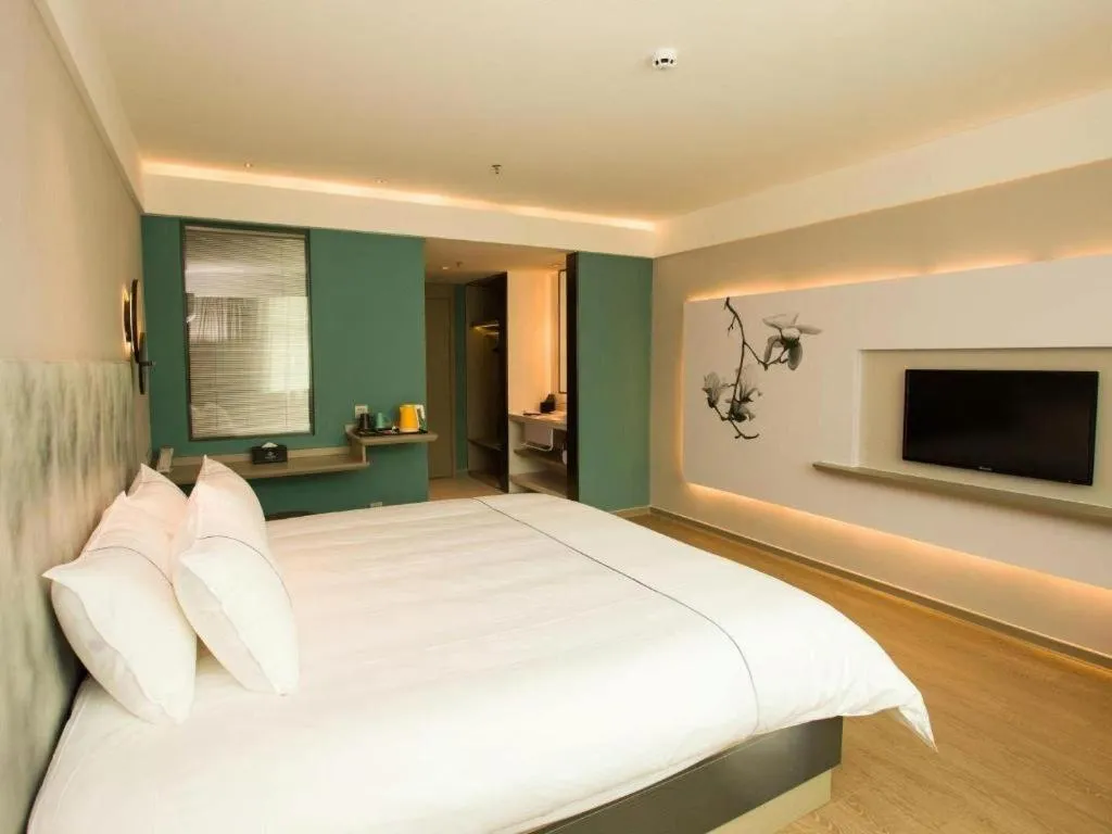 Bed in Magnotel Hotel Huizhou South Station Branch