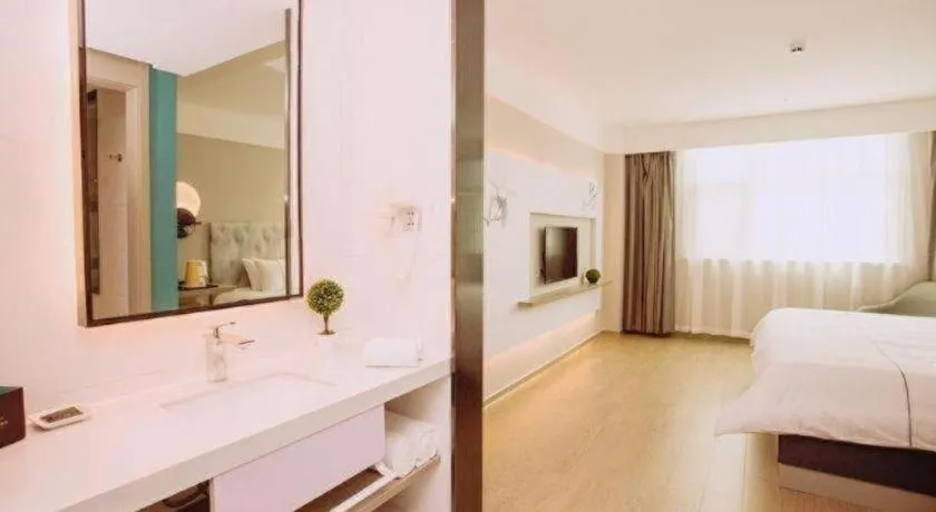 Bed in Magnotel Hotel Huizhou South Station Branch