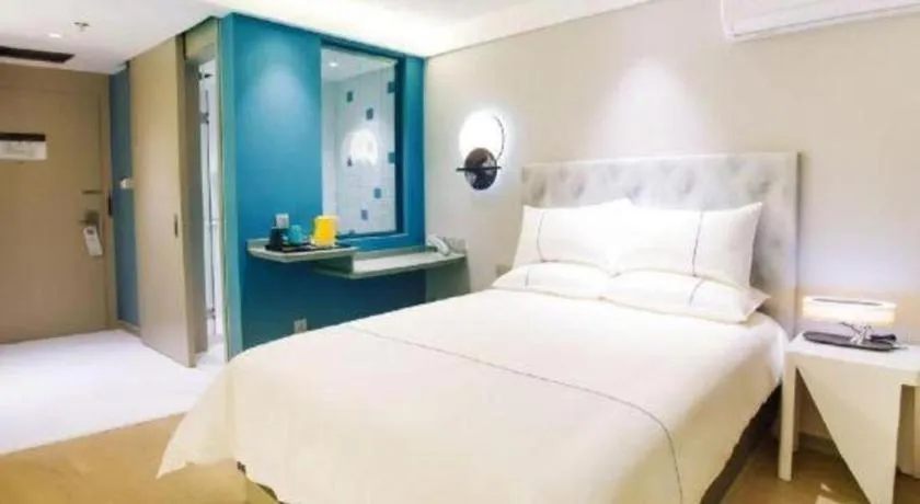 Bed in Magnotel Hotel Huizhou South Station Branch