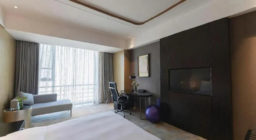 Bed in The QUBE Hotel Jingzhou