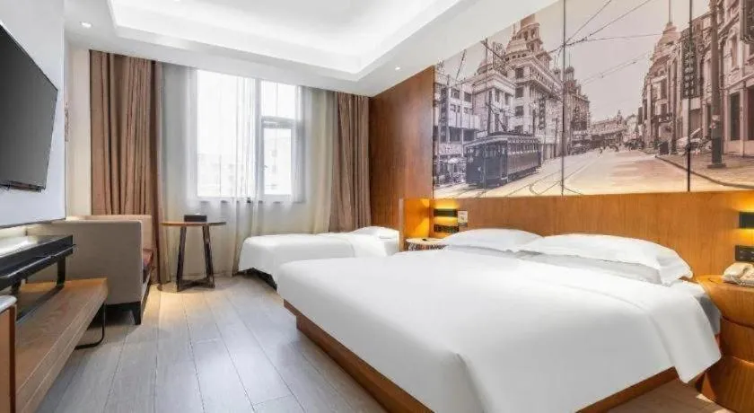 Bed in Jinjiang Metropolo Hotel Shanghai Hongqiao International Exhibition Center Branch