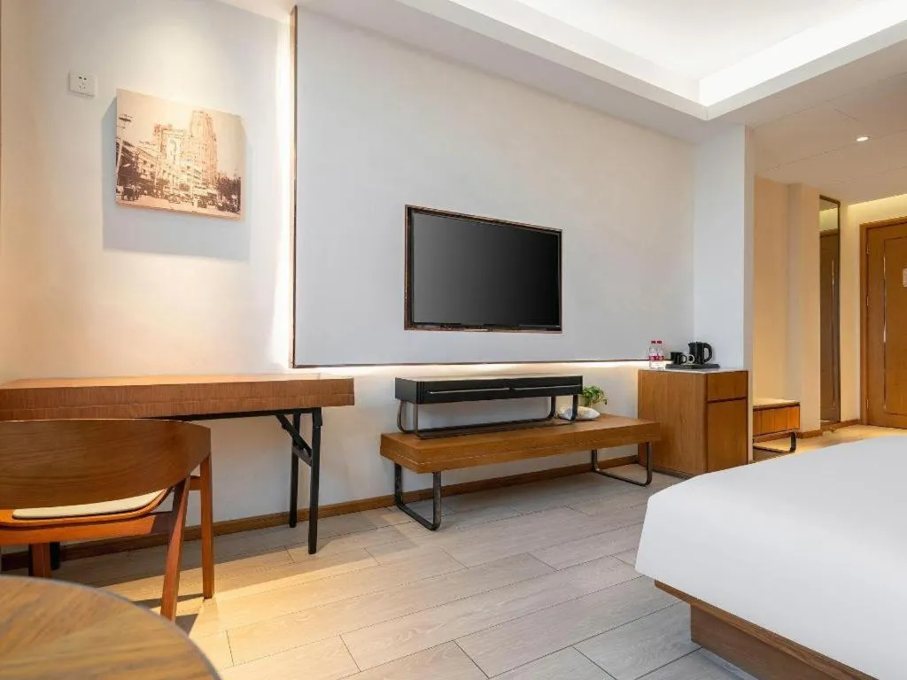 Bed in Jinjiang Metropolo Hotel Shanghai Hongqiao International Exhibition Center Branch