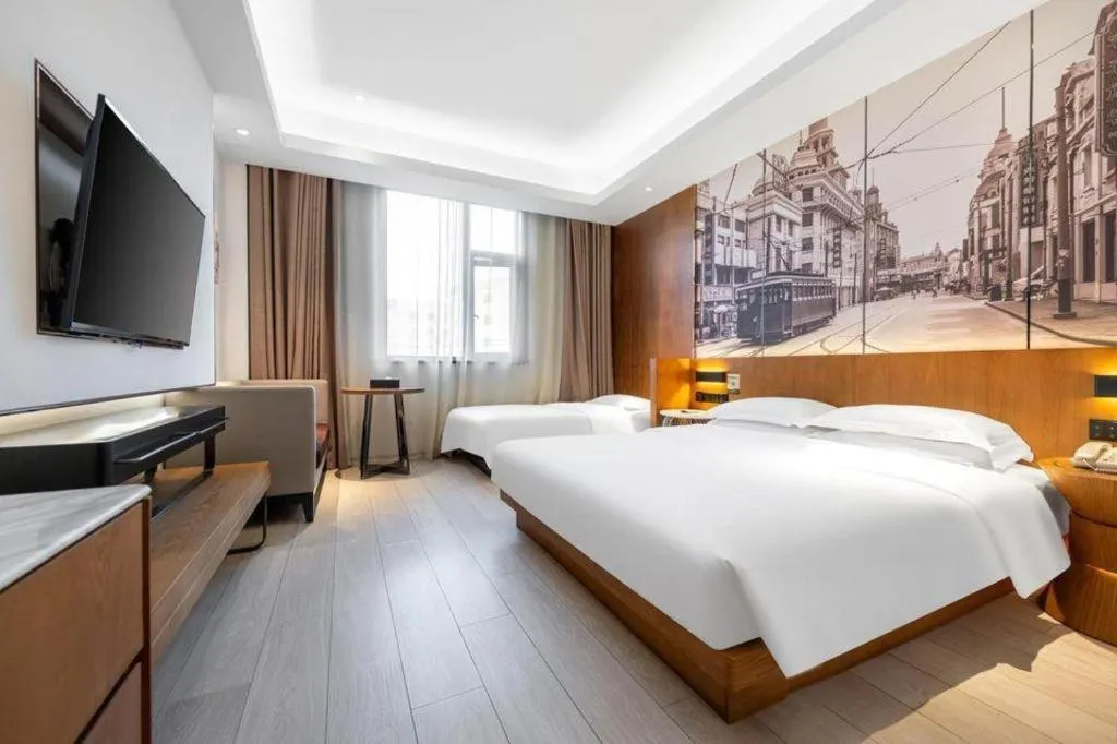 Bed in Jinjiang Metropolo Hotel Shanghai Hongqiao International Exhibition Center Branch