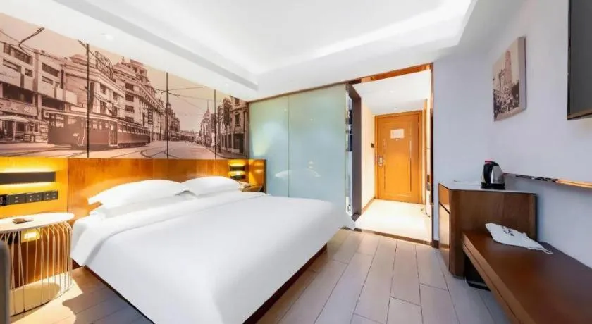 Bed in Jinjiang Metropolo Hotel Shanghai Hongqiao International Exhibition Center Branch