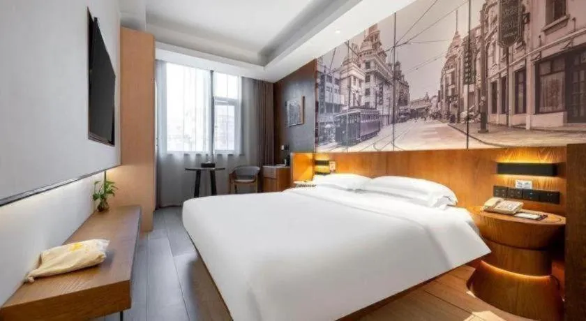 Bed in Jinjiang Metropolo Hotel Shanghai Hongqiao International Exhibition Center Branch