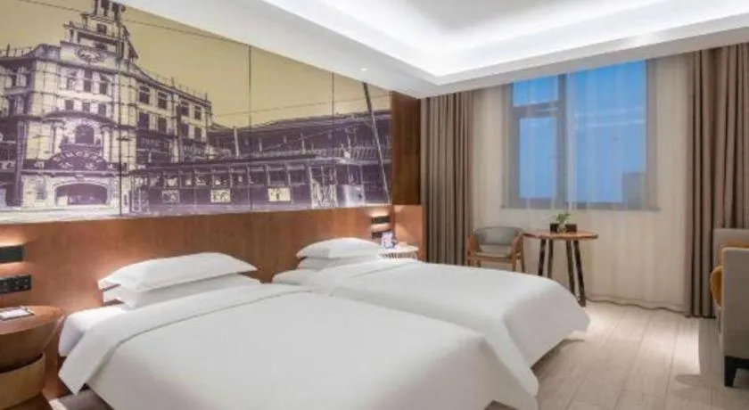 Bed in Jinjiang Metropolo Hotel Shanghai Hongqiao International Exhibition Center Branch