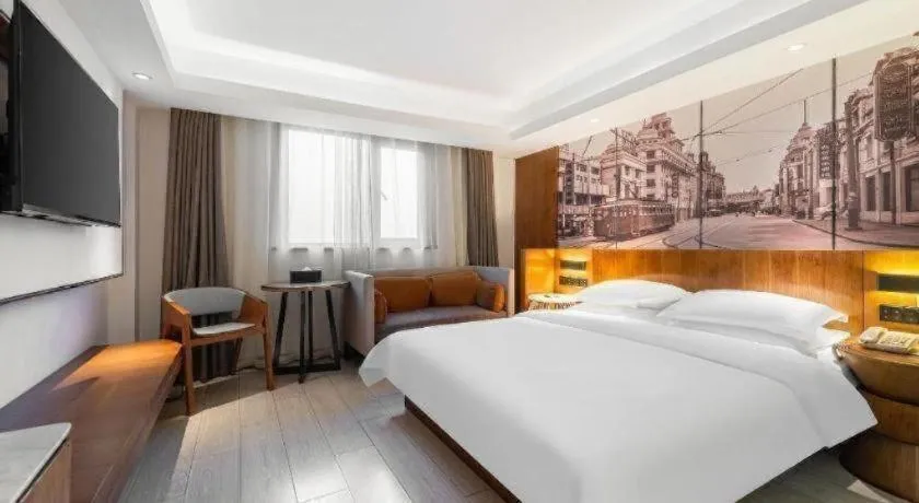 Bed in Jinjiang Metropolo Hotel Shanghai Hongqiao International Exhibition Center Branch