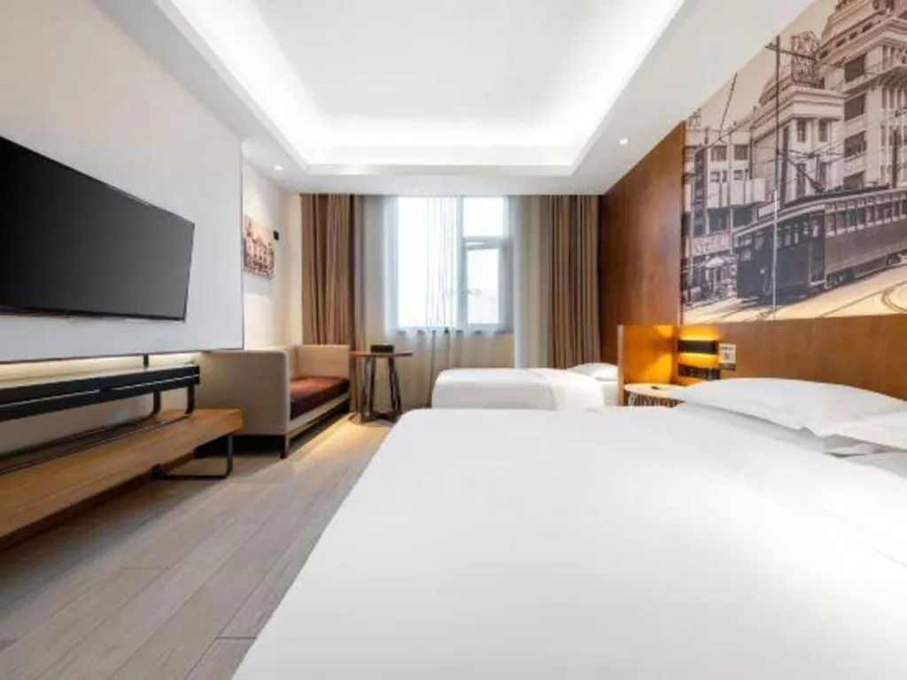 Bed in Jinjiang Metropolo Hotel Shanghai Hongqiao International Exhibition Center Branch