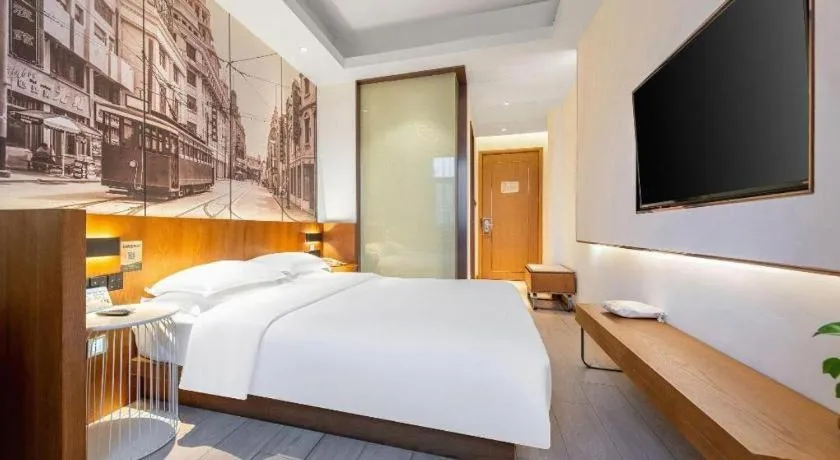 Bed in Jinjiang Metropolo Hotel Shanghai Hongqiao International Exhibition Center Branch