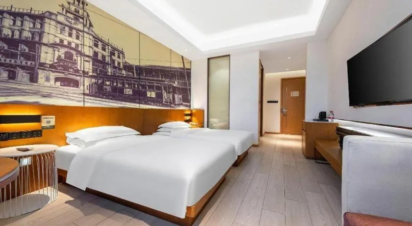 Bed in Jinjiang Metropolo Hotel Shanghai Hongqiao International Exhibition Center Branch