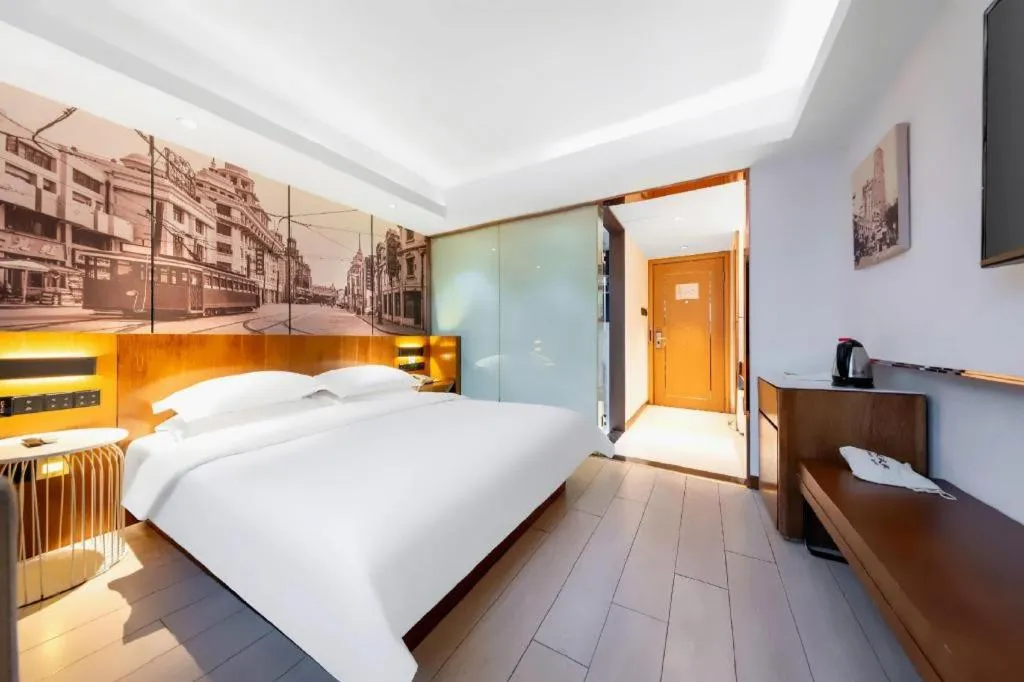 Bed in Jinjiang Metropolo Hotel Shanghai Hongqiao International Exhibition Center Branch