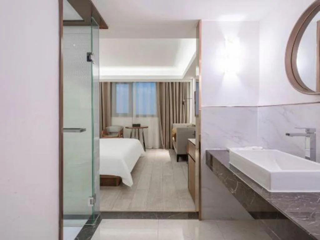 Bed in Jinjiang Metropolo Hotel Shanghai Hongqiao International Exhibition Center Branch