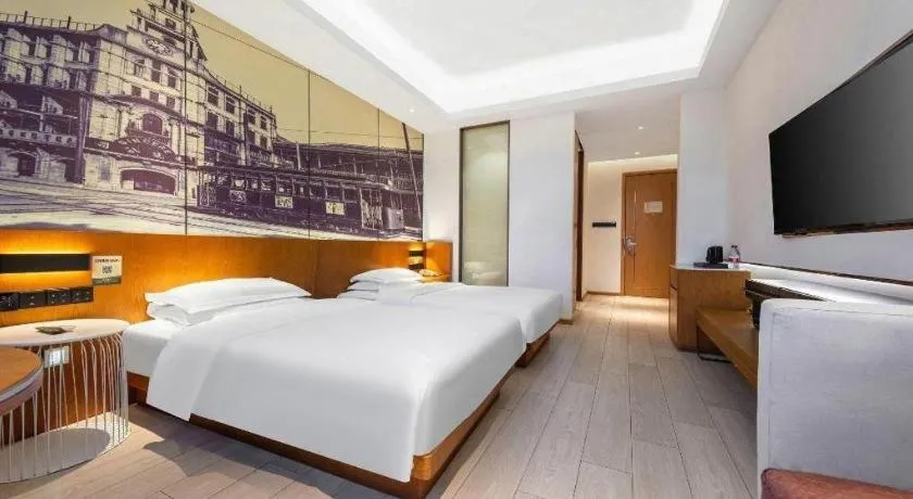 Bed in Jinjiang Metropolo Hotel Shanghai Hongqiao International Exhibition Center Branch