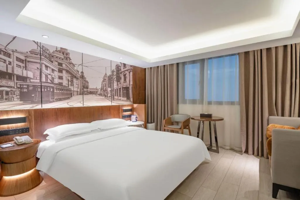 Bed in Jinjiang Metropolo Hotel Shanghai Hongqiao International Exhibition Center Branch
