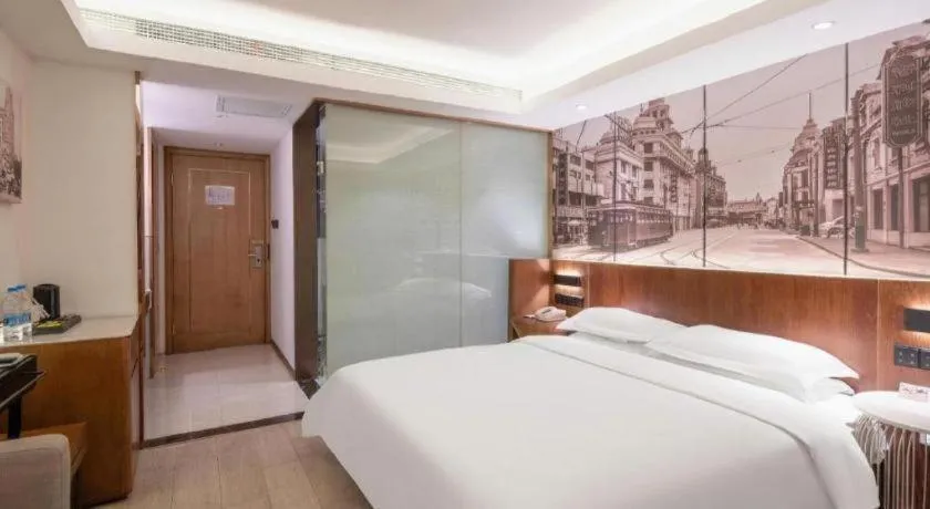 Bed in Jinjiang Metropolo Hotel Shanghai Hongqiao International Exhibition Center Branch