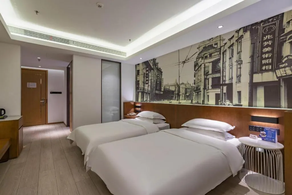 Bed in Jinjiang Metropolo Hotel Shanghai Hongqiao International Exhibition Center Branch