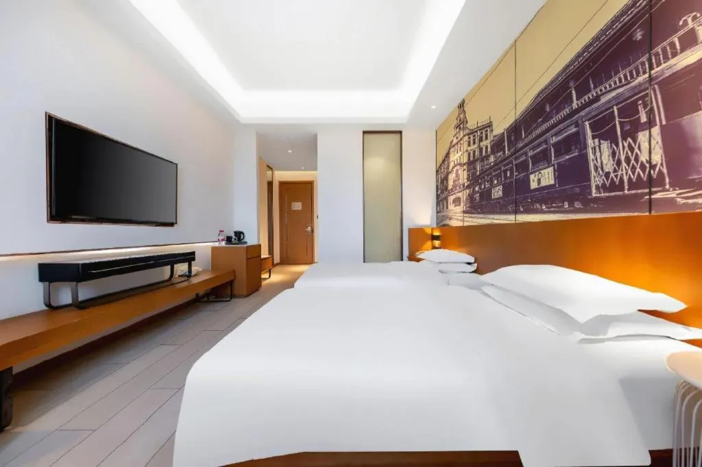 Bed in Jinjiang Metropolo Hotel Shanghai Hongqiao International Exhibition Center Branch