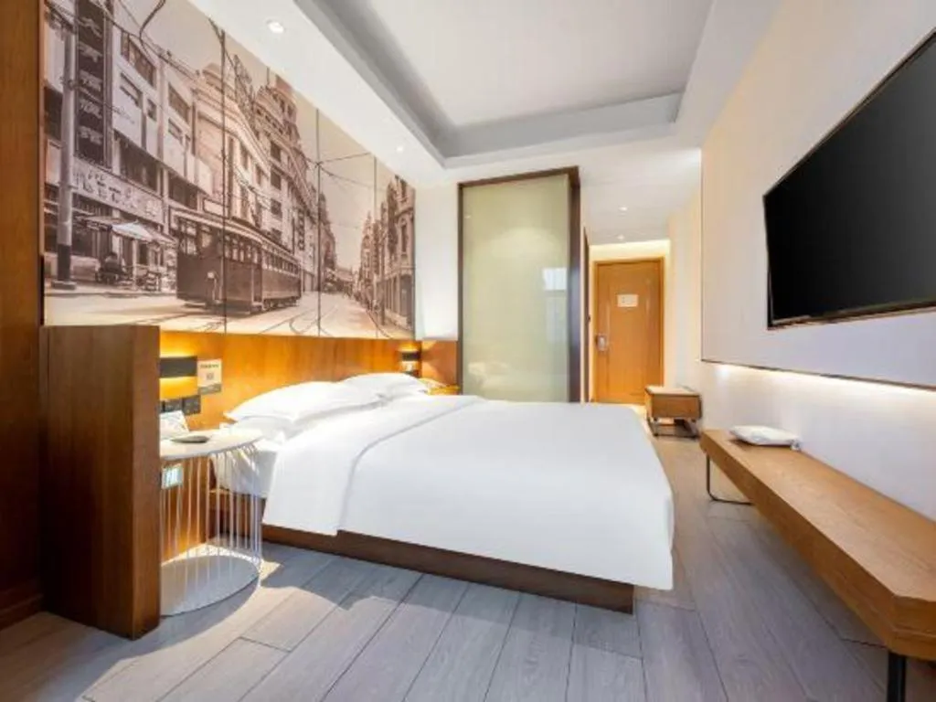 Bed in Jinjiang Metropolo Hotel Shanghai Hongqiao International Exhibition Center Branch