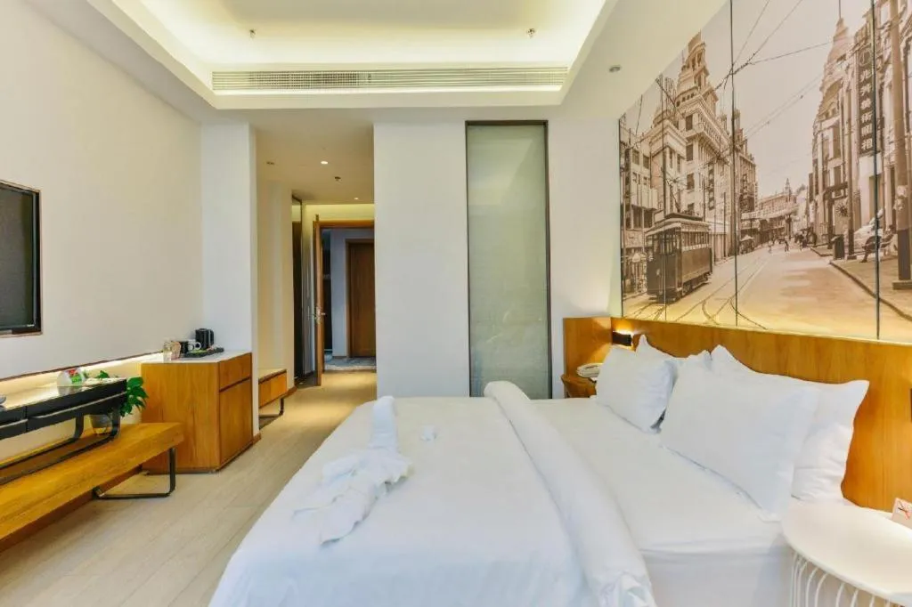 Bed in Jinjiang Metropolo Hotel Shanghai Hongqiao International Exhibition Center Branch