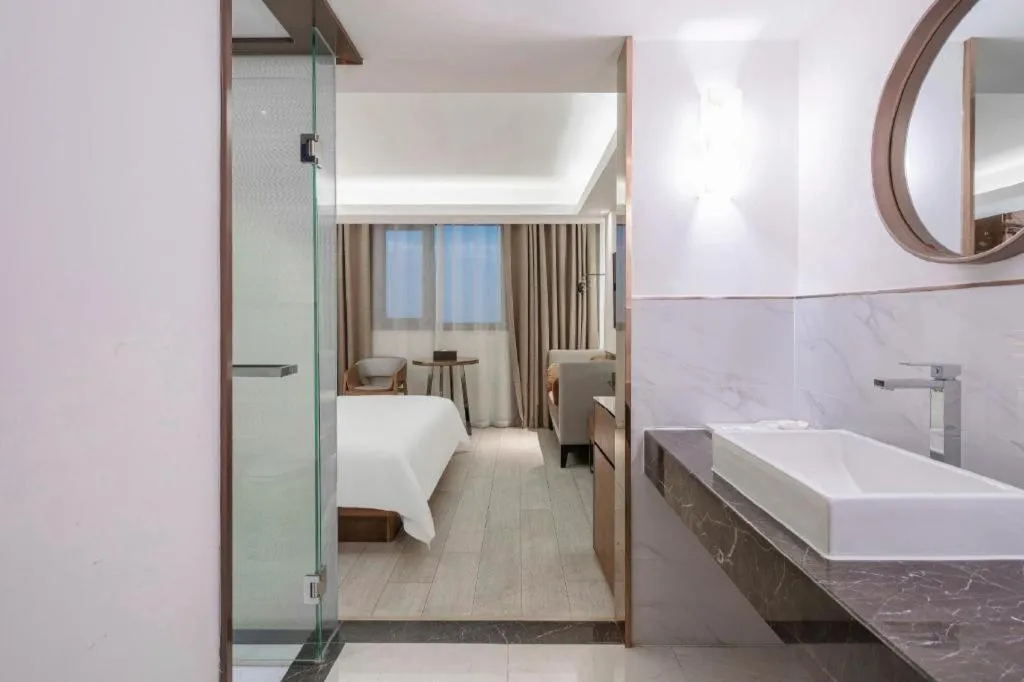 Bed in Jinjiang Metropolo Hotel Shanghai Hongqiao International Exhibition Center Branch